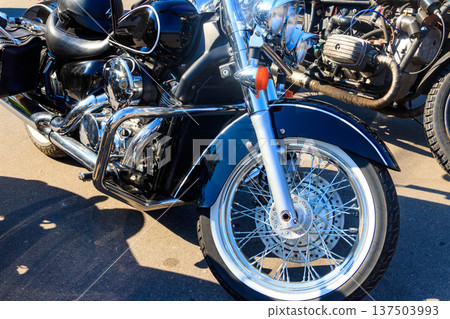 Modern motorcycle parked on a city street Modern motorcycle parked on a city street 137503993