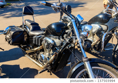Modern motorcycle parked on a city street Modern motorcycle parked on a city street 137503994