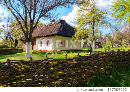 Ancient traditional ukrainian rural house in Open air Museum of Folk Architecture and Folkways of Middle Naddnipryanschina in Pereyaslav, Ukraine Ancient traditional ukrainian rural house in Open air Museum of Folk Architecture and Folkways of Middle Naddnipryanschina in Pereyaslav, Ukraine 137504032