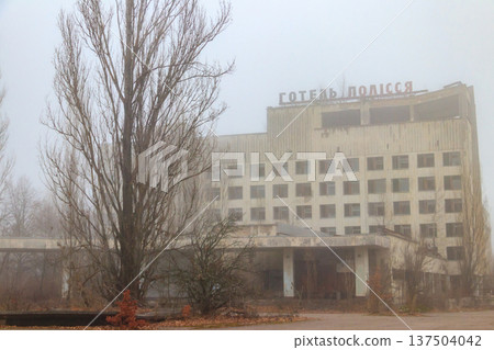 Abandoned building of Polissya hotel in the ghost town Pripyat in Chernobyl Exclusion Zone, Ukraine. Inscription in Ukrainian: Hotel Polissya Abandoned building of Polissya hotel in the ghost town Pripyat in Chernobyl Exclusion Zone, Ukraine. Inscription in Ukrainian: Hotel Polissya 137504042