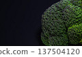 Broccoli floating on a black background 137504120