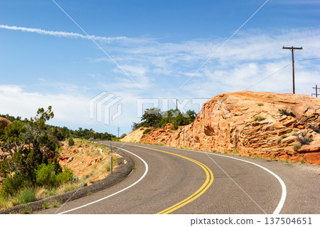Winding desert road in Capitol Reef National Park, inviting scenic travel Winding desert road in Capitol Reef National Park, inviting scenic travel 137504651
