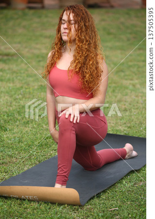Healthy Lifestyle Woman Practicing Yoga in Nature Healthy Lifestyle Woman Practicing Yoga in Nature 137505395