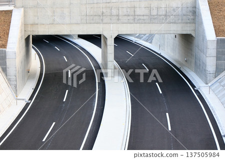 The jet-black road just before it opens 137505984