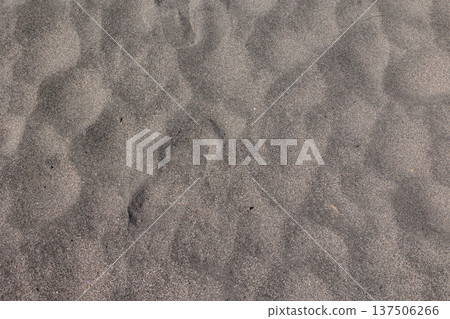 Realistic sandy beach texture and ripple effect; natural beach sand and summer-themed background photo material. Realistic sandy beach texture and ripple effect; natural beach sand and summer-themed background photo material. 137506266