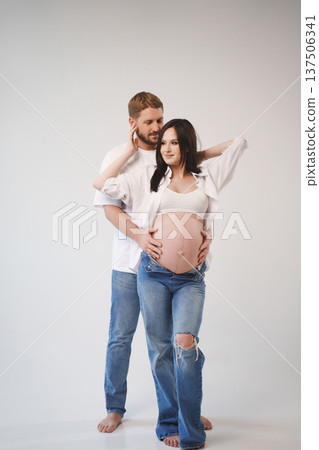 Couple sharing a tender moment before baby arrives 137506341