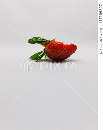 Bitten Strawberry isolated on a white background. Fresh red berry 137506807