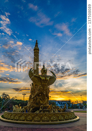 Stunning sky at sunrise above Golden Garuda Monument Stunning sky at sunrise above Golden Garuda Monument 137508089