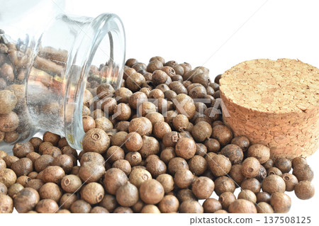 Allspice peas in a glass container. Allspice peas in a glass container. 137508125