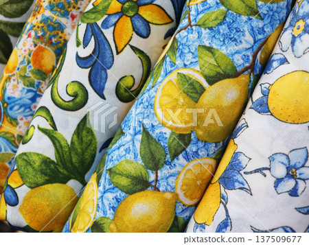Rolled Fabrics with Vibrant Lemon and Floral Patterns Rolled Fabrics with Vibrant Lemon and Floral Patterns 137509677