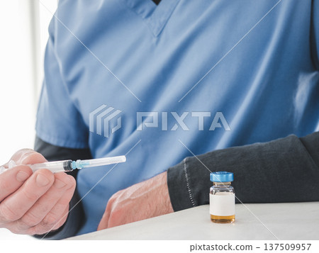 Medical worker in a blue scrubs Medical worker in a blue scrubs 137509957