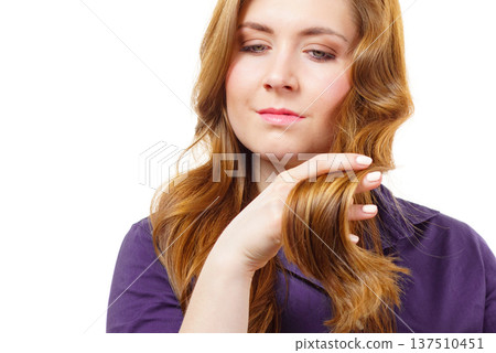 Woman with long hair shows healthy ends 137510451