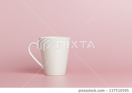 white cup for tea or coffee on a pink background 137510595