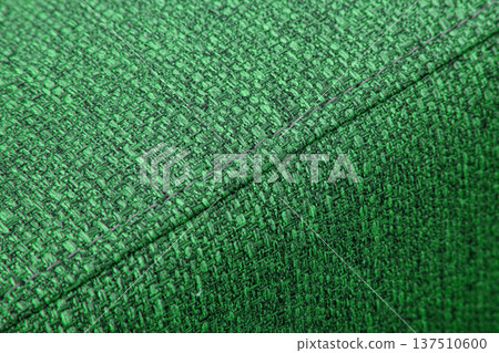 Textured green furniture fabric with stitching 137510600