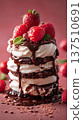 Delicious dessert stack featuring layers of chocolate cake, whipped cream, fresh strawberries, and raspberry sauce, creating an enticing visual treat for dessert lovers and food enthusiasts 137510691