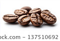Freshly roasted coffee beans arranged artistically on a clean white background, showcasing their rich texture and deep brown color, perfect for coffee lovers and culinary enthusiasts 137510692