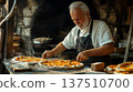 Senior man with gray hair, wearing an apron, is preparing fresh pizzas in a rustic kitchen, showcasing culinary skills and passion for traditional cooking methods 137510700