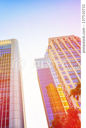 Skyscrapers tower glass buildings in sunlight. Facade office buildings. High-rise bank building. Skyscrapers tower glass buildings in sunlight. Facade office buildings. High-rise bank building. 137510732