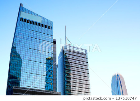 Skyscrapers tower glass buildings. Facade office buildings. High-rise bank building. Hong Kong Skyscrapers tower glass buildings. Facade office buildings. High-rise bank building. Hong Kong 137510747
