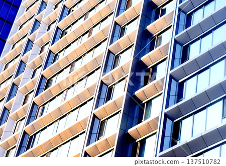 Residential building facade background, texture. Residential apartment building with winwows Residential building facade background, texture. Residential apartment building with winwows 137510782