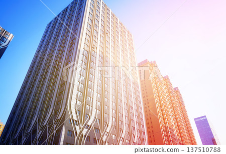 Glass tower building on blue sky background. Facade of new modern business office building. Glass tower building on blue sky background. Facade of new modern business office building. 137510788