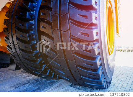 Tires of mining truck. Heavy Machinery Tire. Large tire for heavy machinery. Biggest tires, tyre 137510802