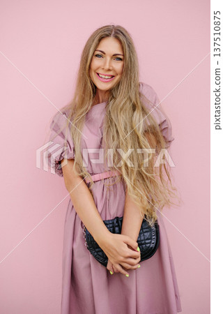 Smiling Woman In Pink Dress With Long Hai Smiling Woman In Pink Dress With Long Hai 137510875