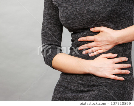 Woman having strong stomach ache. Syndroms Woman having strong stomach ache. Syndroms 137510899
