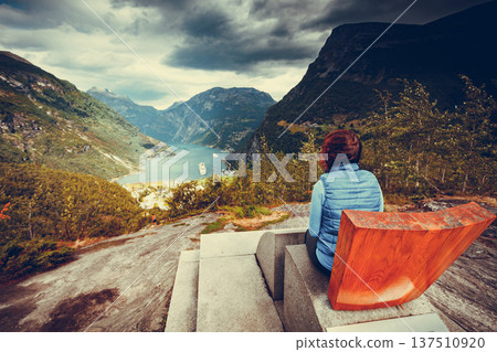 Tourist enjoying Geirangerfjord from viewing point 137510920