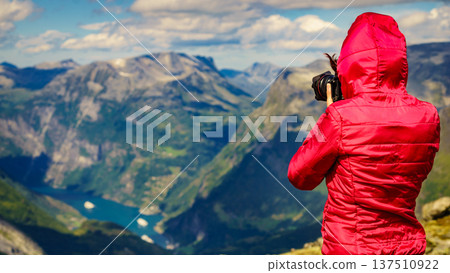Tourist taking photo from Dalsnibba viewpoint Norway 137510922