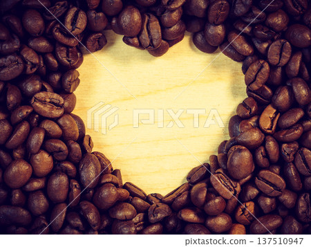 Roasted coffee beans with heart form Roasted coffee beans with heart form 137510947