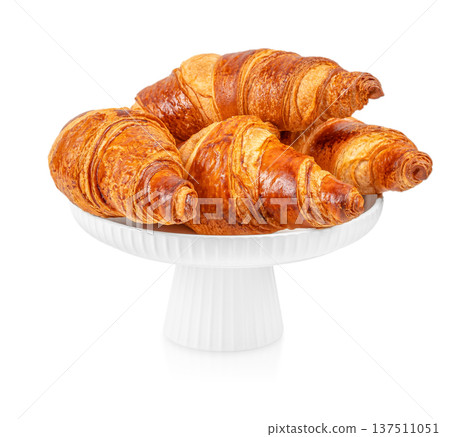 Fresh Butter Croissants on Cake Stand Isolated on Light Background 137511051