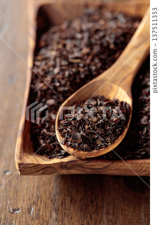 Black tea on an old wooden table. Black tea on an old wooden table. 137511353