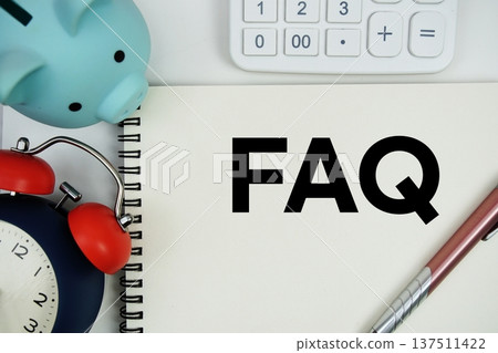 FAQ text written notepad with calculator, piggy bank and alarm clock on white background FAQ text written notepad with calculator, piggy bank and alarm clock on white background 137511422