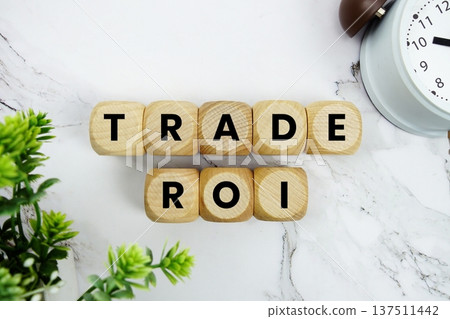 Trade ROI Trading performance analytics alphabet letters and alarm clock on marble background Trade ROI Trading performance analytics alphabet letters and alarm clock on marble background 137511442