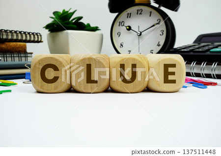 CLUE alphabet letters with alarm clock and calculator on white background 137511448