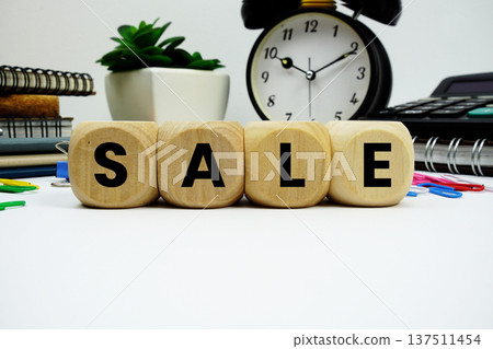 SALE alphabet letters with alarm clock and calculator on white background 137511454
