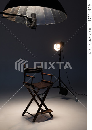 Professional photo studio setup with director chair, softbox and spotlight lighting equipment Professional photo studio setup with director chair, softbox and spotlight lighting equipment 137511469