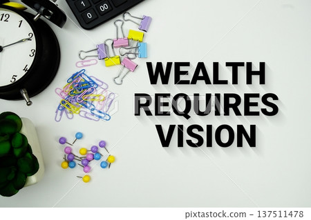 Wealth Requires Vision message with calculator, alarm clock and Stationery on white background 137511478