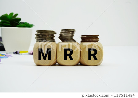 Stack of coins with wood blocks with "MRR (Minimum Retail Rate)" Financial concept Stack of coins with wood blocks with "MRR (Minimum Retail Rate)" Financial concept 137511484