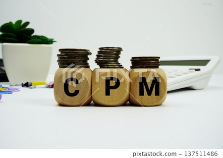 Stack of coins with wood blocks with "CPM (Cost Per Thousand Impressions)" Financial concept 137511486