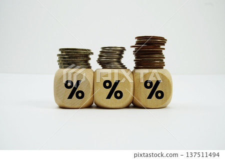 Stack of coins with Wood blocks with percentage symbol Stack of coins with Wood blocks with percentage symbol 137511494