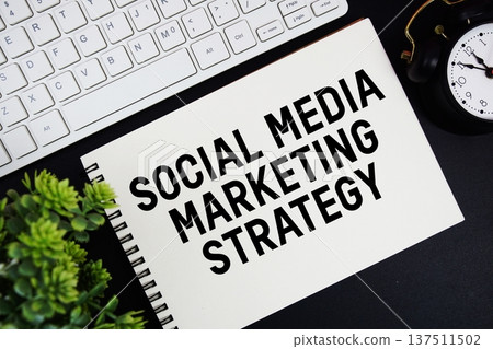 Social Media Marketing Strategy text written on notepad with keyboard and alarm clock on black background Social Media Marketing Strategy text written on notepad with keyboard and alarm clock on black background 137511502