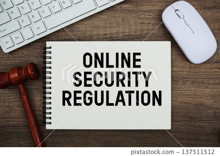 Online Security Regulation text written with gavel, keyboard and optical mouse on wooden background Online Security Regulation text written with gavel, keyboard and optical mouse on wooden background 137511512