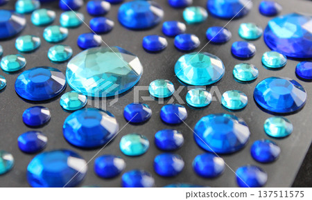 Set Of Variety Size Round Blue Rhinestones On Dark Surface Set Of Variety Size Round Blue Rhinestones On Dark Surface 137511575