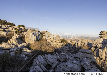 Visit to El Torcal in Spain shows unique rock formations and landscape under clear sky Visit to El Torcal in Spain shows unique rock formations and landscape under clear sky 137511668