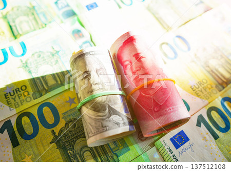 Chinese yuan, US dollars on Euro money Euro currency background. Chinese yuan, US dollars Chinese yuan, US dollars on Euro money Euro currency background. Chinese yuan, US dollars 137512108