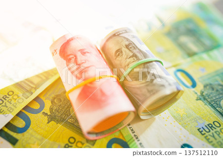 Chinese yuan, US dollars on Euro money Euro currency background. Chinese yuan, Chinese yuan, US dollars on Euro money Euro currency background. Chinese yuan, 137512110