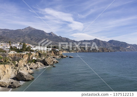Coastline view of Nerja, Spain with mountains and sea under blue sky 137512213
