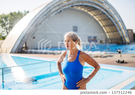 Senior woman getting ready for swim. 137512246